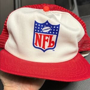 This is a vintage 80s NFL New Era red and white trucker snapback hat.